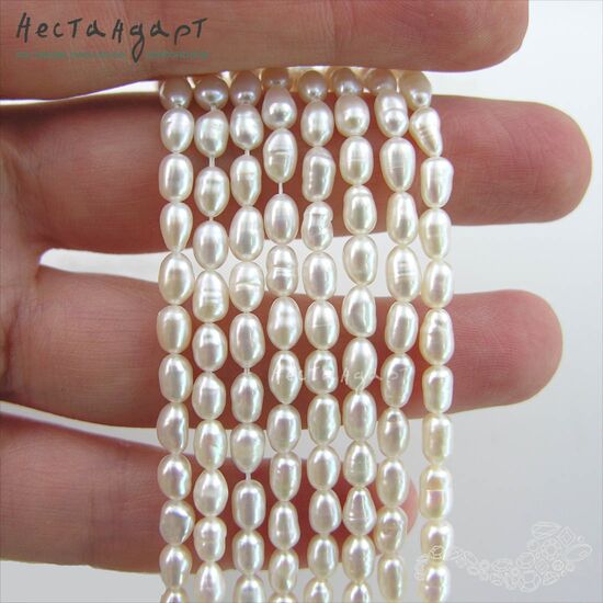 Жемчуг натуральный белый Baroque Rice 6-9 мм (нить 17 см), изображение 2